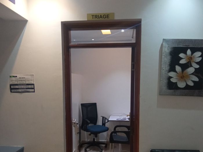 The triage room at A.S.E. Dorothea Mission Hospital, with a weighing scale and blood pressure machine