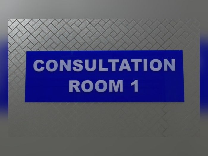 Consultation room sign at RKA Specialist Hospital, Kitui