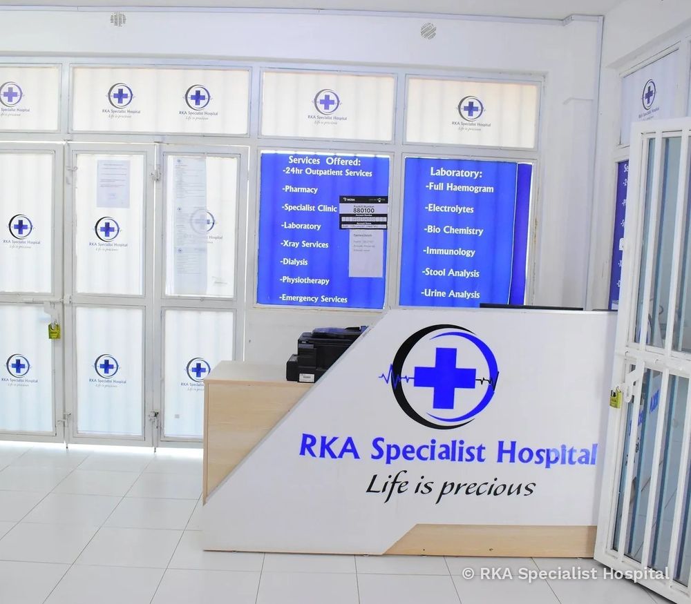 The reception desk at RKA Specialist Hospital, with the list of services on the wall behind it